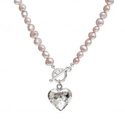 pink pearl necklace with beaten silver heart